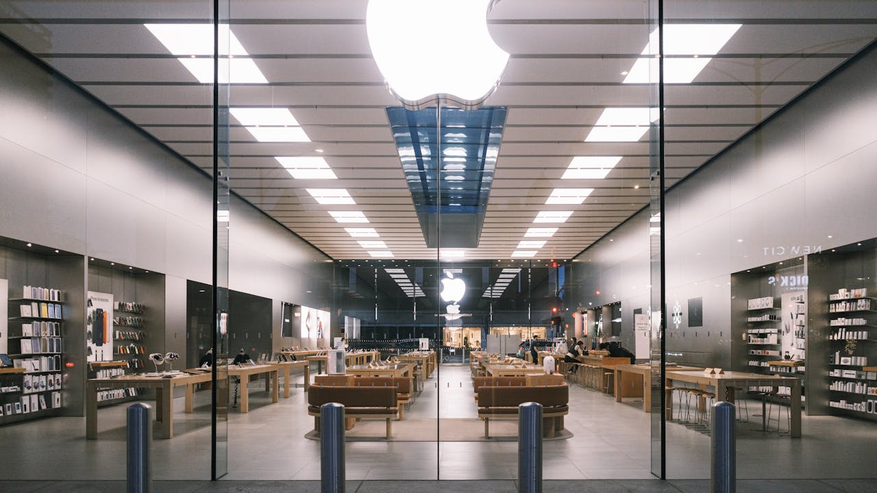 Explore the minimalist design of a modern tech store interior, showcasing a bright, elegant layout.